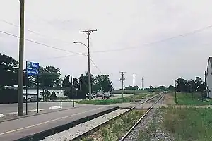 A small railway platform next to a single track