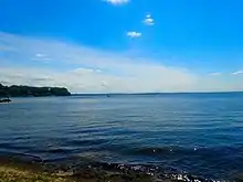 Sunny photo of Lake Mendota in Madison, Wisconsin during the summer.