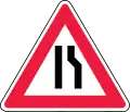 Road narrows on right side