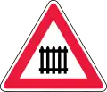 Level crossing ahead, with gates