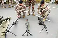 Latvian soldiers with MG3, FN MAG and HK21 machine guns