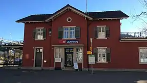 Two-story station building with gabled roof