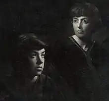 Photograph of two young women with short hair dressed in black robes