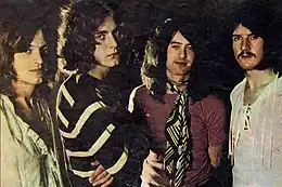 Head-shot photographs of each of the four members of Led Zeppelin