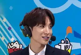 Close up of Leeteuk wearing a headset