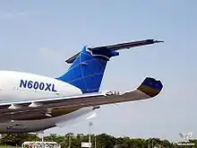 Left wing of jet aircraft N600XL, with its upturned vertical winglet broken off