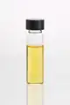 Lemongrass (Cymbopogon flexuosus) essential oil in clear glass vial