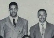 Bob Mann and Len Ford wearing suits standing next to each other