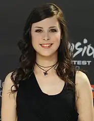 Lena Meyer-Landrut wearing a cross necklace of the ecumenical Christian Taizé Community