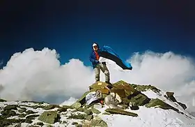 Jaan Künnap atop Ibn Sina peak, the first time the Estonian flag was displayed higher than 7000m.