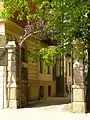 Two gate posts with lattice from 1890 at the beginning of Martiusstraße to the 1889 by Friedrich Steffan neo-Renaissance building on the corner of Leopoldstraße