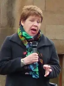 Colour photograph of Lesley Hinds speaking at the 2017 People's Climate March rally in Edinburgh