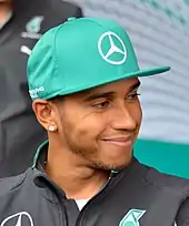 A picture of Lewis Hamilton donning Mercedes Grand Prix attire.