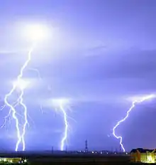 Four bolts of lightning strike the ground