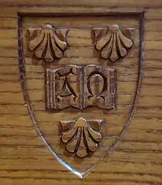 The college's arms on oak wood