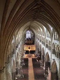 Nave of Lincoln Cathedral. showing three levels; arcades (bottom); tribunes {middle} and clerestory (top).