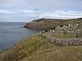 View of the graveyard at Llanbadrig church showing its position on the coast.