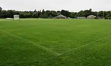 A picture depicting the local recreation grounds, with the rugby field in prominent view.