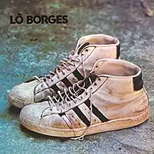 The cover of Lo Borges 1972 album. It is a photograph of a pair of sneakers against a slate blue background.