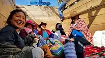 Locals and a volunteer transporting goods in a livestock truck to the Chinchaypujio market