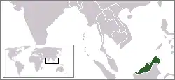 A black and white general world map with East Malaysia highlighted in green