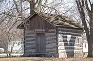 Log smokehouse and gift shop, Novinger log homestead.