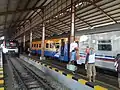 Batara Kresna Railbus and Lagowa train at the station platform