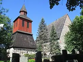 Bell tower. The masonry part dates probably to the Middle Ages and the wooden part was constructed around year 1740.