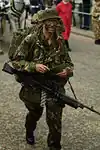A British soldier wearing No.8: trousers, parka and bush hat.