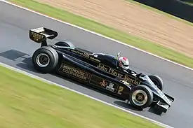 The Lotus 91 being exhibited in March 2007. This car was presented to Tamiya Corporation, a sponsor in the 1991 season, by Lotus