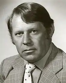 Black and white photo of Lou Lefaive in a suit and tie