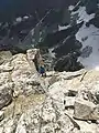 Lowe climbing the famous V Pitch on the Upper Exum Ridge of the Grand Teton in August 2019 for his 75th birthday.