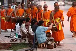 Image 7Monks gathering morning alms (from Culture of Laos)