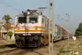 Lucknow AC being hauled by a Ghaziabad-based WAP-5 with LHB rake on first run