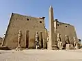 Entrance of the Luxor Temple, western façade; a pair of obelisks usually stood in front of a pylon; the 2nd obelisk (the Luxor Obelisk, 23 metres (75 ft) high, not shown) had been moved to France.