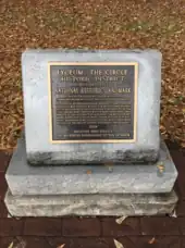 A plaque from the National Park Service declaring the site of the riot to be a National Historical Site