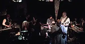 M'lumbo onstage at Bowery Electric March 2, 2013 with Page Hamilton. Left to right: Vin Veloso, Maureen O'Connor, Brian O'Neill, Paul Meurens, Jarek Szczyglak, Jaz Sawyer, Cecil Young, Page Hamilton, Dehran Duckworth, Rob Ray.