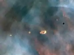 Image 6Hubble image of protoplanetary discs in the Orion Nebula, a light-years-wide stellar nursery probably very similar to the primordial nebula from which the Sun formed (from Formation and evolution of the Solar System)