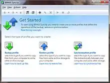 Screenshot of @MAX SyncUp: a Microsoft Windows window with menubar and toolbar, with the title "Get Started" above text reading "To start using @MAX SyncUp you need to create one or more profiles that define the operation of the backup, restore or synchronization." Below that is blue text reading "Read the key concepts", then below that, "Select the type of profile you want to create." There are three profile icons: one with a green arrow pointing down reading "Backup profile: select this type if you want to copy files from your computer to some other archive storage.", one with a blue arrow pointing up reading "Restore profile: select this type if you want to copy files from some archive storage to your computer", and one with both arrows reading "Synchronization profile: select this type if you want to copy files bidirectionally between your computer and some other storage".