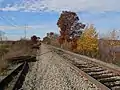 MBTA commuter tracks through park