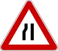 Road narrows on left side