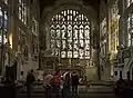 View of chancel of Holy Trinity Church, monument on left wall