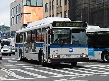 A Q65 bus outside the station, at Main Street and Roosevelt Avenue