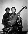 A Chinese woman playing a pipa, 1870