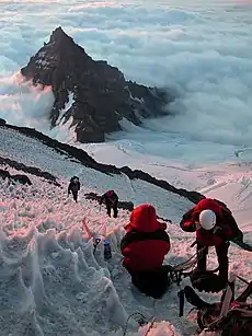 Image 39Mountain climbers ascending Mount Rainier looking at Little Tahoma Peak (from Mountaineering)