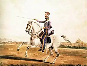 Indian cavalry trooper armed with a sabre and two pistols.