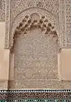 One of the niches on the walls of the courtyard with stucco carved into muqarnas