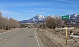 Maher in 2016, with Mount Lamborn in the distance