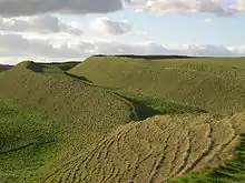 Image 9View of the ramparts of the hillfort of Maiden Castle (450 BC), as they look today (from History of England)