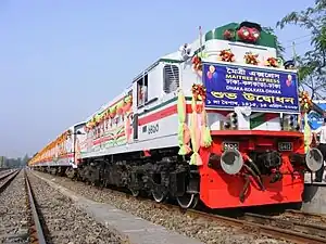 Decorated white diesel passenger train